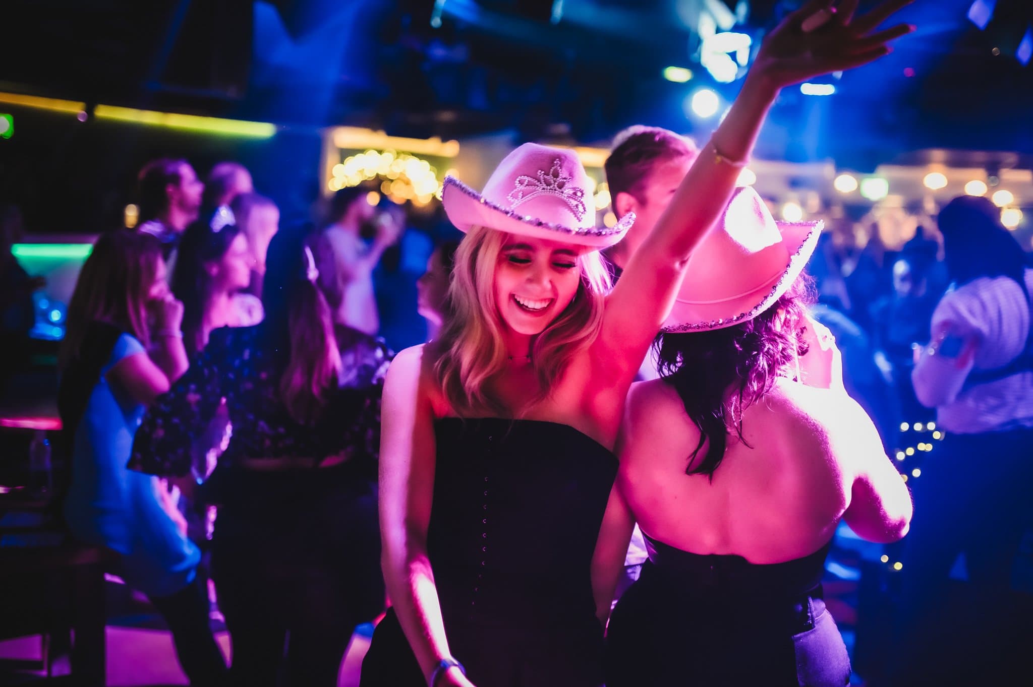 A women wearing a cowgirl hat dancing in Piano Works